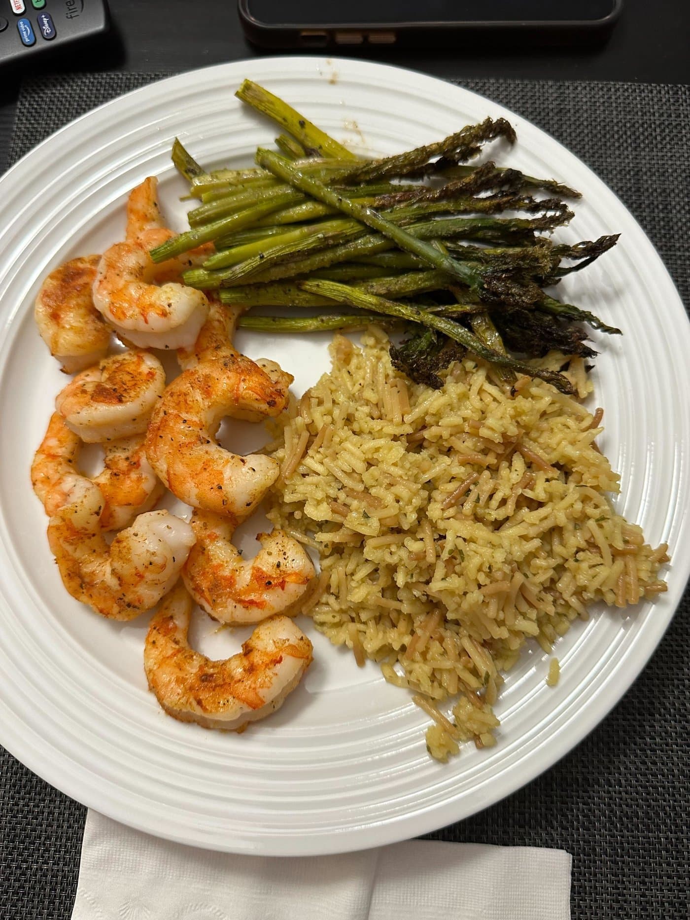Air-fried shrimp served with rice and asparagus illustrating multi-zone meal prep