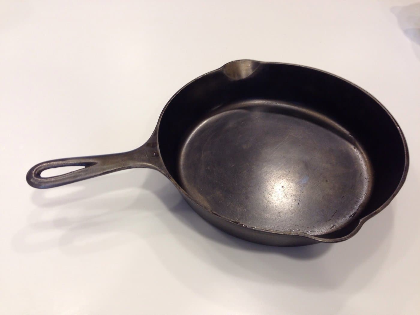 Vintage Griswold cast iron skillet displaying classic smooth cooking surface